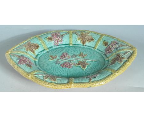 An antique 19th Century Victorian majolica plate / dish in the manner of George Jones. The plate of oval lozenge shaped form 