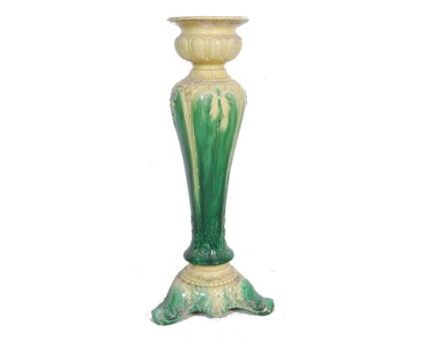 An early 20th century circa 1930’s ceramic Majolica style plant stand / jardinière having green and yellow two tone colour sc