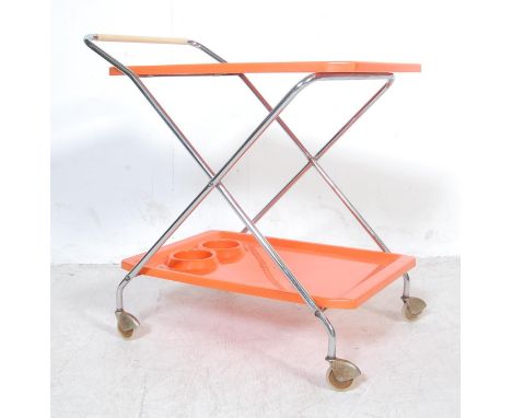 A vintage retro 1970’s folding trolley / drinks cocktail trolley having two bright orange plastic trays and chrome tubular fr