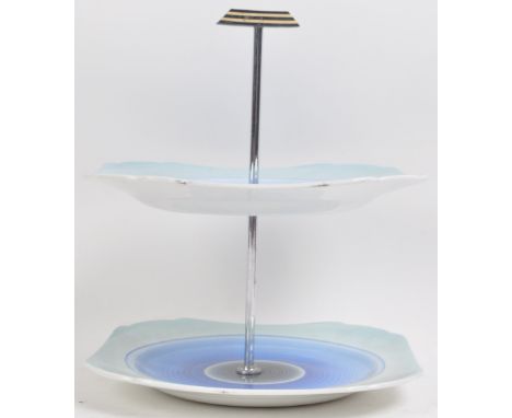 A Shelley 1930's Art Deco Harmony cake stand having two square cake plates painted in blue with chrome supports and a black a