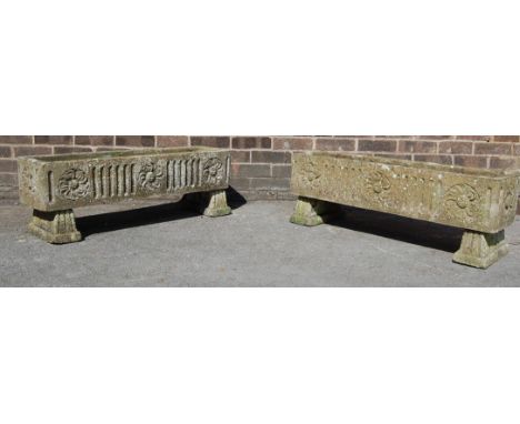 A pair of 20th Century well weather reconstituted garden planters of rectangular trough form, decorated with moulded floral m