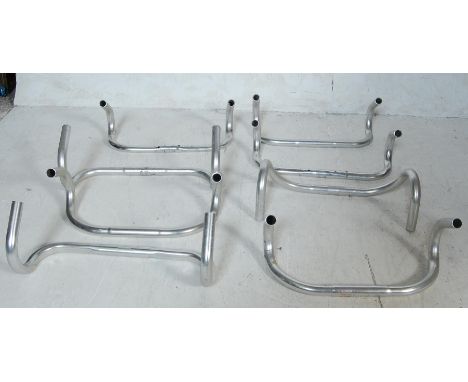 A collection of eight retro vintage late 20th century metal bicycle handlebars. Brands include 3TTT Grand Prix and more. Meas