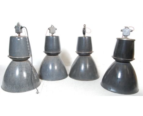 A collection of four&nbsp;large retro vintage 20th century industrial factory black enamel ceiling lights. Each retaining the