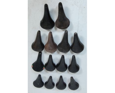A collection of fourteen retro vintage late 20th century bicycle seats. Brands include Zeus, Arius Gran Carrera, Milremo and 