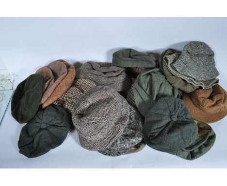 A large collection of vintage 20th century tweed hats comprising of round brimmed hats, Deer stalkers caps, fishing hats, fla