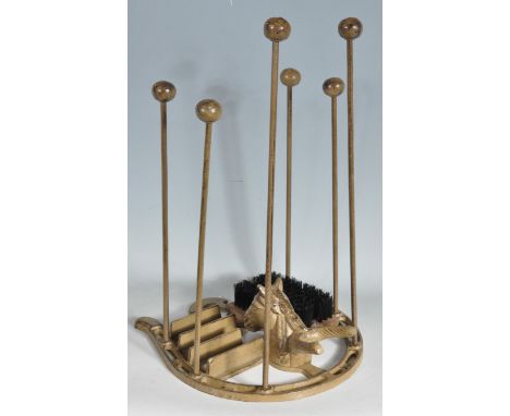 A vintage style cast iron wellington boot scrape and rack, the base in the form of a horse shoe with a boot pull in the form 