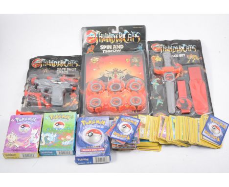 Thundercats toys in blister packs, along with a selection of vintage Pokemon cards, one box. 