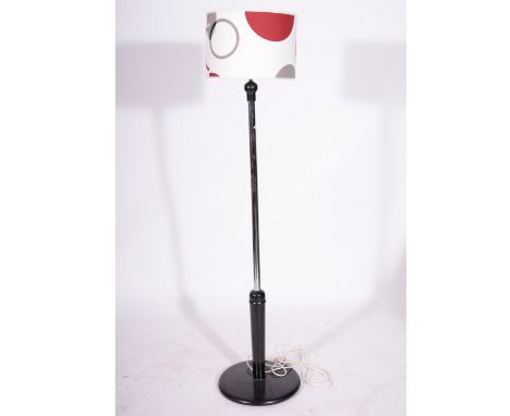 Tubular chrome and ebonised standard lamp, with shade 183cm overall.