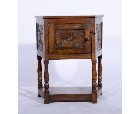 Reproduction joined oak cupboard, carved panel door, shelf under, width 64cm.