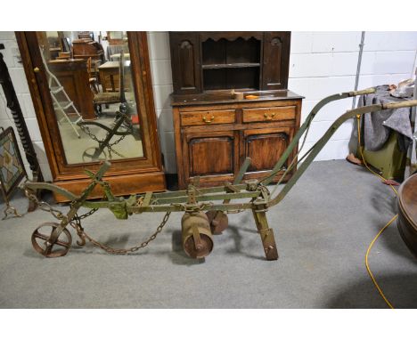 Vintage mechanical turf cutter; old grinding wheel; two small staddle stones; and bird bath. (5)