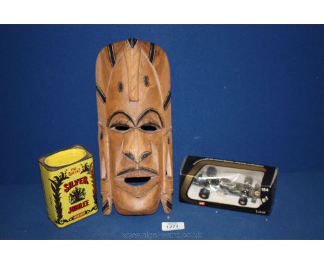 A wooden tribal face Mask, a Corgi Lotus John Player Special car, boxed and a Colman's Mustard QEII Silver Jubilee Tin.