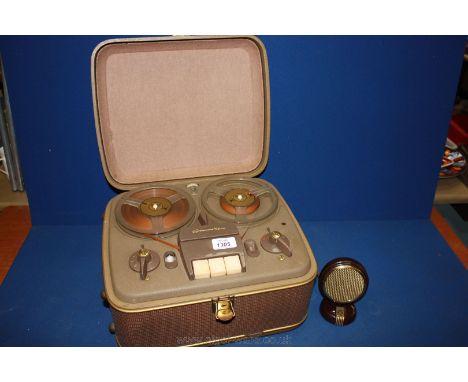 An old tape to tape Recorder by Grundig with Bakelite Microphone.