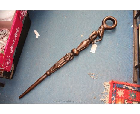 A vintage Ghanaian chieftain's Staff with loop handle carved with a man smoking a pipe and zoomorphic creatures