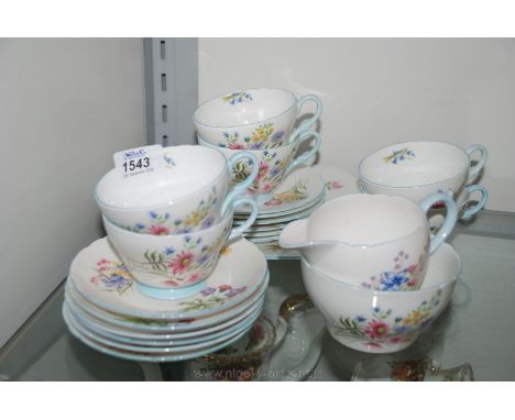 A Shelly Teaset in 'Wild Flower' pattern comprising six cups, six saucers, six tea plates, bread and butter plate, milk jug a