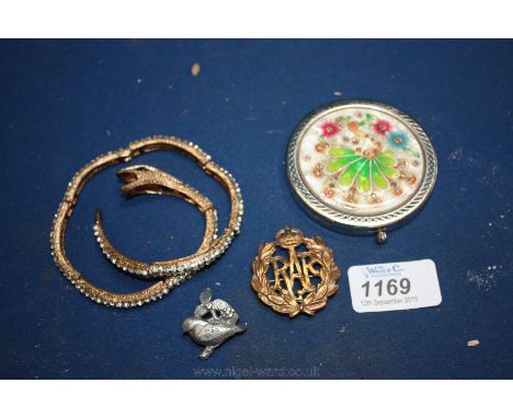 Two brooches, snake Bracelet and Compact.