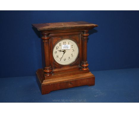 A wooden cased column detail Mantle Clock.