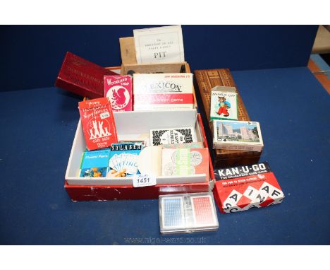 A complete wooden Chess Set, a travel chess set and a quantity of playing cards.