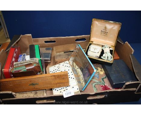 A quantity of playing cards, three boxes of dominoes, travel chess set, cribbage board, boxed Ronson shaver, etc.