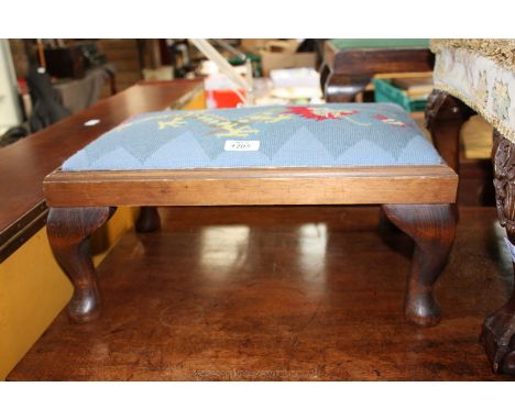 A Footstool having tapestry top with dragon design, on cabriole feet