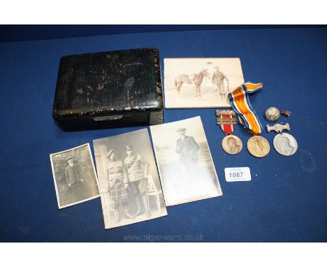 Two old military Photographs and two others, military Button, a 1911 King's Medal, a 1914-19 King's Medal and a 1914-1919 Vic