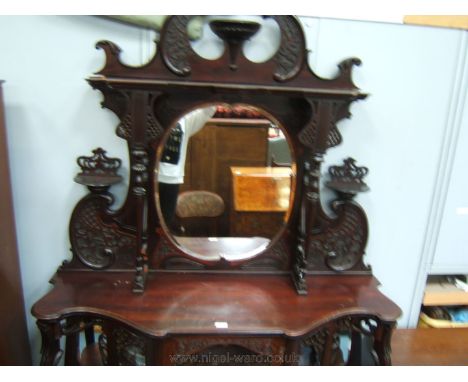 A very ornate Victorian Chiffonier cabinet in Chippendale style, having stylized swan pediment top with central reeded and fl