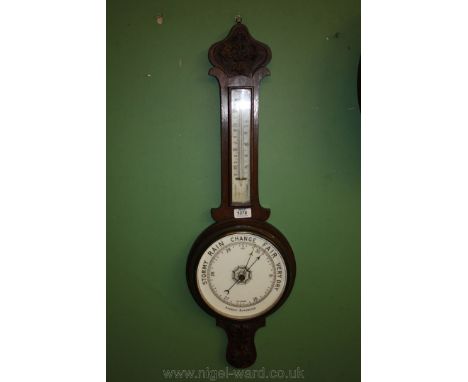 A carved banjo Barometer/thermometer.
