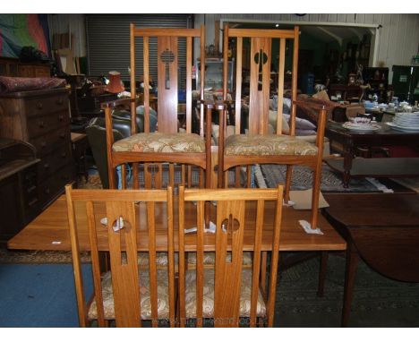 **A modern Reynolds of Ludlow, light Teak Dining suite comprising rectangular top dining table and six (including two carvers