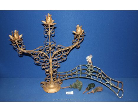 A gold plated candelabra and a part of a vintage clothes airer.