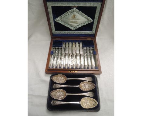 A canteen of twelve silver plated dessert knives and forks having mother of pearl handles and decorative knops and collars, r