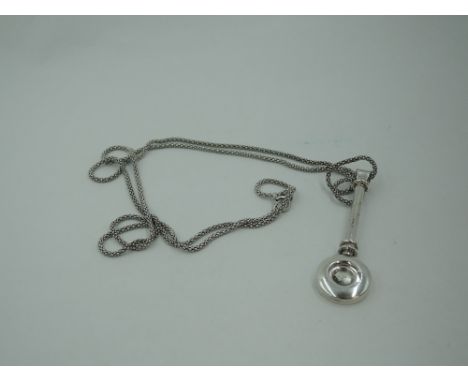 A silver napkin clip of plain form, Birmingham 2009, A J Poole, on a silver chain