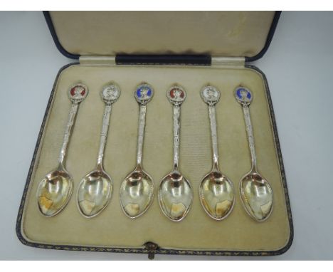 A cased set of six silver coffee spoons having enamelled terminals commemorating the Silver Jubilee for George V, Birmingham 