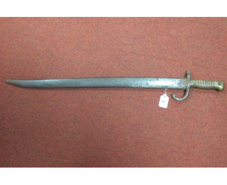 A XIX Century French Sabre Bayonet, dated 1869, some chips and rust spots to blade, dent to grip/spring holes, with scabbard,