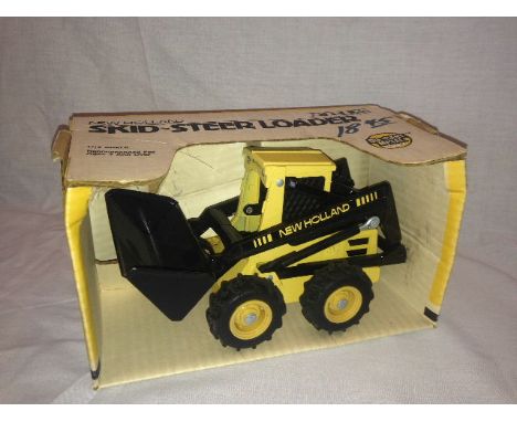 ERTL - NEW HOLLAND SKID STEER LOADER (320) - SCALE 1:16
