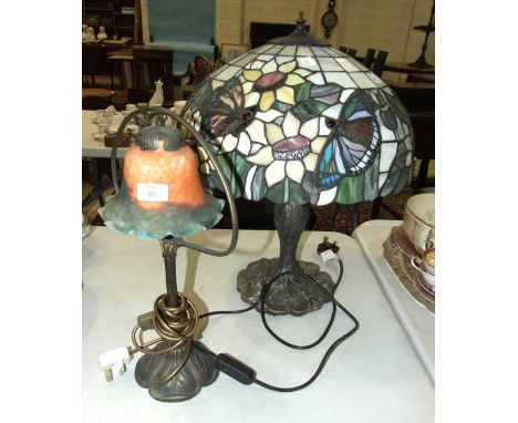 A modern Tiffany style table lamp, the shade decorated with butterflies, 58cm high and another modern table lamp, (2).