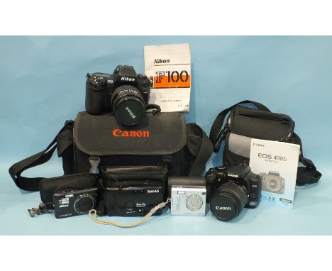 A Nikon F100 camera, a Canon Power Shot G2 camera, a Canon EOS 400D digital camera, other cameras and accessories.