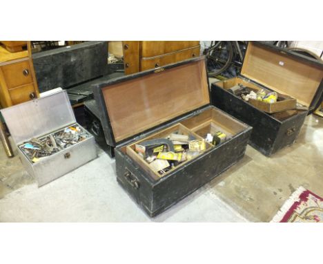 A quantity of various hand tools contained in three wooden tool chests.