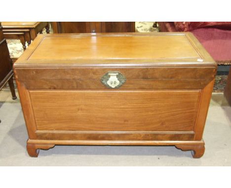 A 20th century rectangular camphor wood chest on bracket feet, 102cm wide, 72cm high.