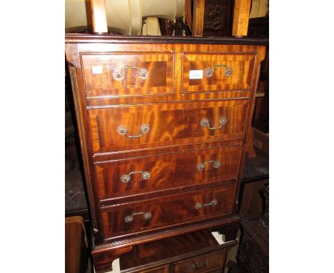 Small reproduction mahogany bedside chest of two short and three long drawers with brass handles and bracket feet, 24ins wide