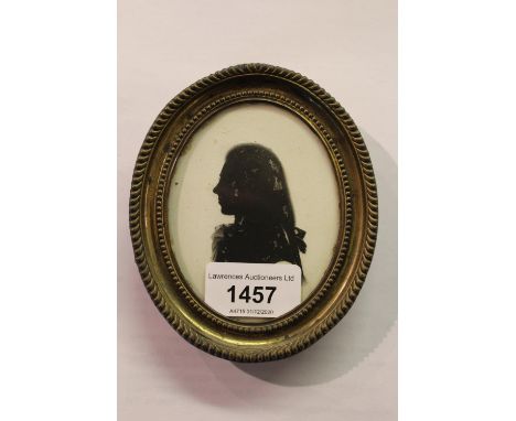 Late 18th Century, silhouette portrait of a young man, together with another similar of Mrs Lydia Vallaint, gilt framed 
