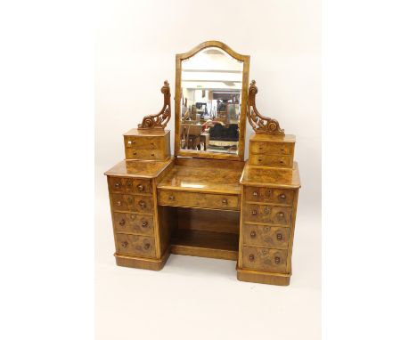 Victorian burr walnut twin pedestal dressing table with a swing mirror and jewel drawers, the base with eight drawers, knob h