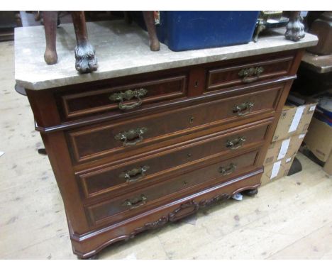 19th Century French mahogany commode with a beige marble top above two short and three long drawers, a shaped frieze raised o