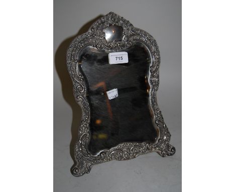 Birmingham silver floral and C scroll embossed dressing table mirror, 12ins high 