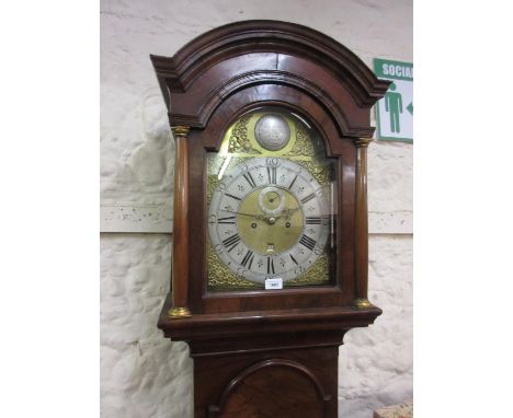 Figured walnut longcase clock, the broken arch hood with flanking pilasters above a moulded panel door and conforming plinth 