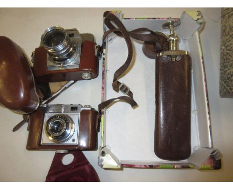 Zeiss TTL camera with leather case together with an Agfa camera and a tripod 