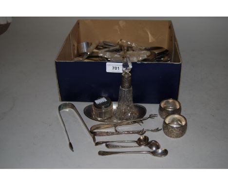 Oval silver trinket dish, pair of silver napkin rings, three pairs of silver sugar tongs, three condiment spoons, two silver 