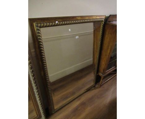 Large 20th Century gilt framed rectangular wall mirror with bevelled plate, 42ins x 55ins (at fault) 