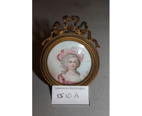 Circular miniature portrait of a lady in ormolu frame with bow surmountThe miniature itself is about 45mm diameter.  The fram