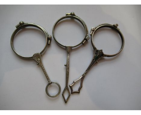 Three various white metal lorgnette frames (no glass) 