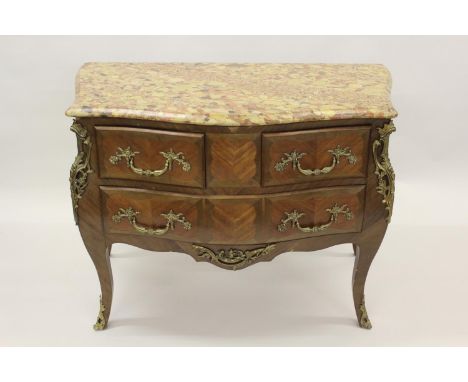 Early 20th Century French cherry wood crossbanded and line inlaid bombe commode, the flecked coloured marble top above two sh