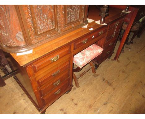 James Shoolbred, late 19th / early 20th Century mahogany Aesthetic movement desk having simulated leather inset top above an 